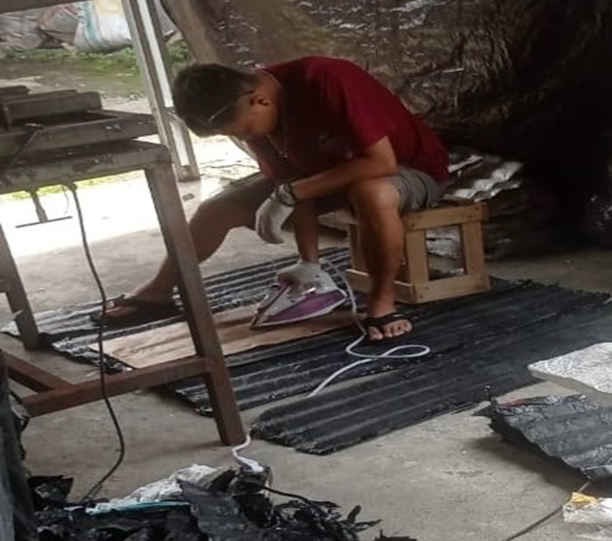 making a roof panel with recycled plastics